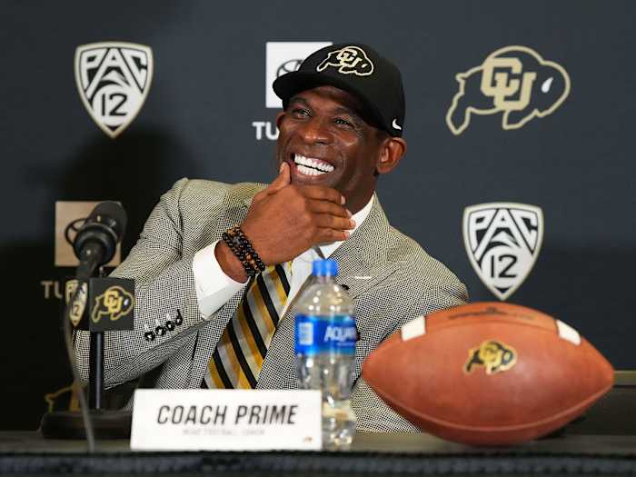 Deion Sanders smiles at his introductory presser at Colorado